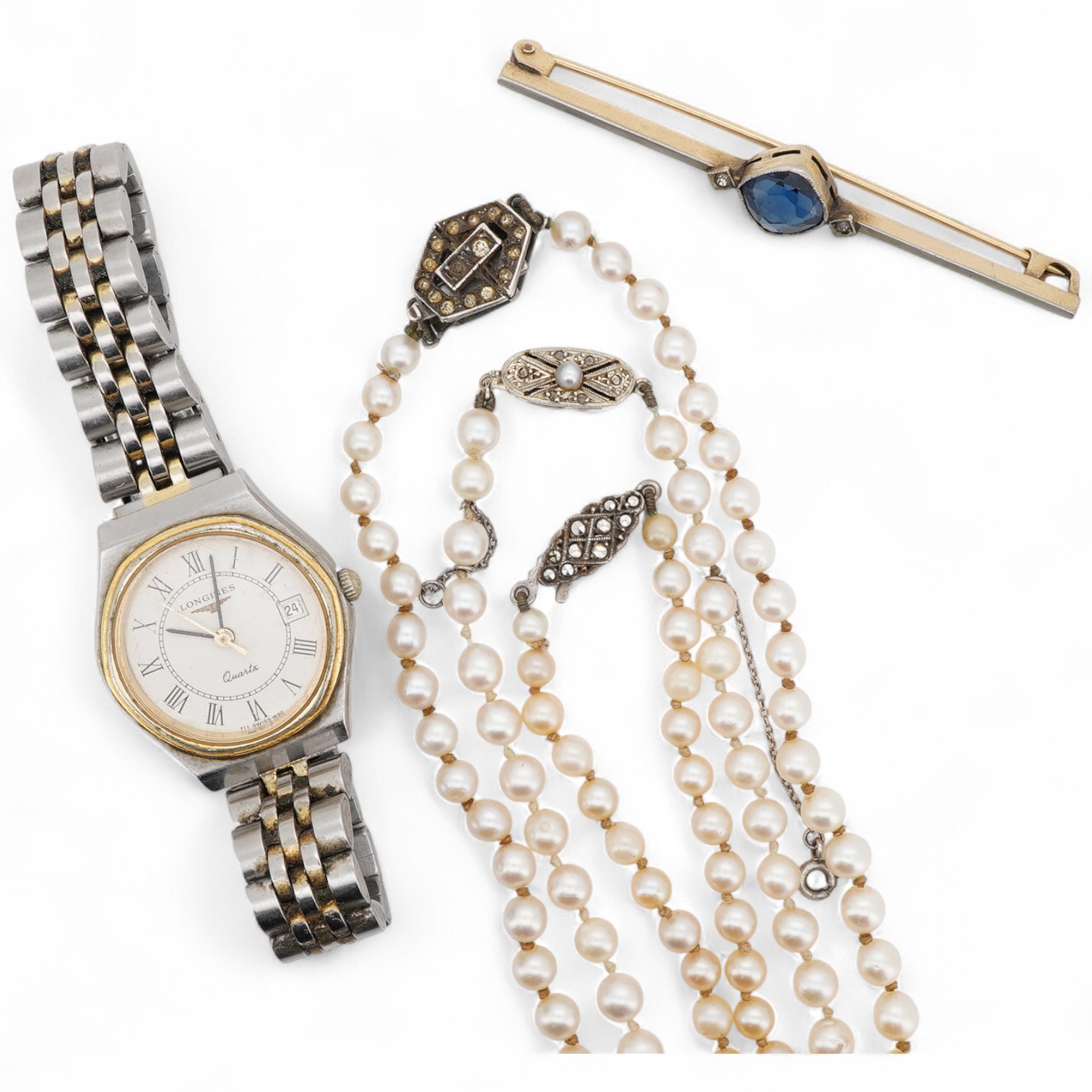 A collection of jewels and a Longines wristwatch, comprising: three cultured pearl necklaces, the longest 52cm, together with a synthetic sapphire and paste bar brooch, length 6cm; and a lady's Longines bicoloured stainl